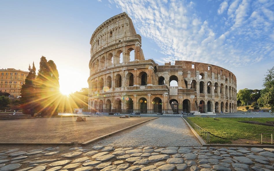 View of Colosseum in Rome and morning sun, Italy, Europe.